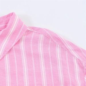 Close-up of pink and white vertical striped shirt showing collar detail and fabric texture