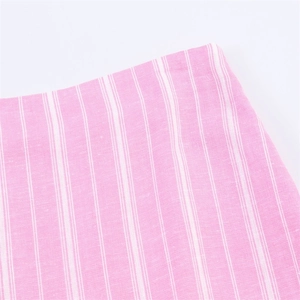 Detail of pink and white vertical striped fabric with breathable cotton linen texture