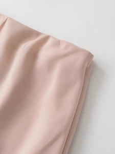 Detailed close-up of pink chiffon skirt waistband showing smooth fabric texture and finish