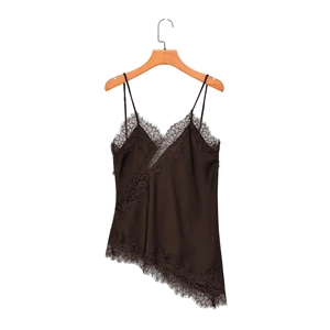 Detailed view of dark brown satin camisole with delicate eyelash lace trim on white background