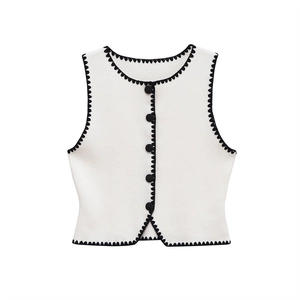 Elegant sleeveless cream vest with scalloped black contrast trim and front buttons