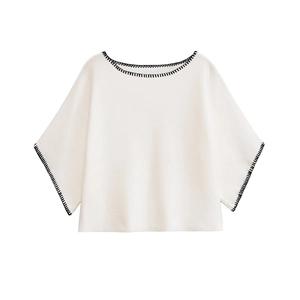 Elegant cream knit cropped top with black contrast stitching and stylish wide batwing sleeves
