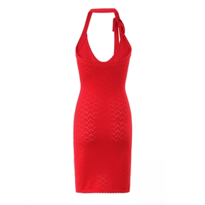Detail of red halter knit dress featuring elegant shoulder bow and wavy hollow texture