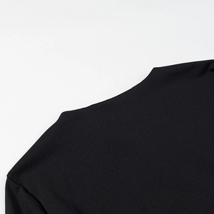 Close-up of black base shirt featuring delicate lace stitching on neckline and shoulder
