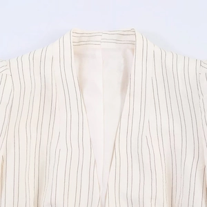 Women's street style white striped blazer with V-neck and stylish puff shoulders