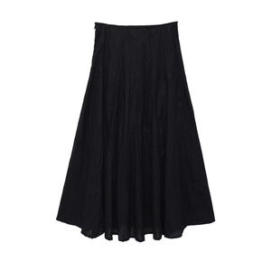 Detailed view of the black A-line midi skirt showing natural wrinkled fabric texture