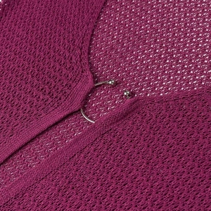 Detail of purple crochet knit texture with stylish silver metal ring buckle design