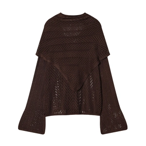 Detail of dark brown crochet knit top with triangular back layering and flared sleeves