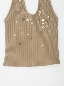 Detail of khaki ribbed knit tank top with decorative assorted buttons on U-neckline