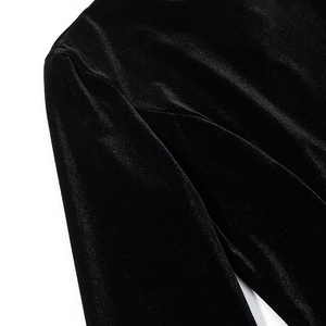 Close-up of premium black velvet fabric texture showing rich luster and fine stitching