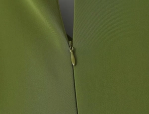 Macro view of olive green dress showing high-quality twill fabric and hidden zipper