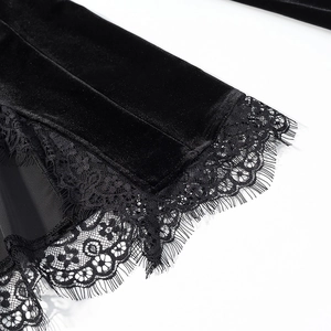 Detailed close-up of black velvet fabric with delicate eyelash lace trim for women