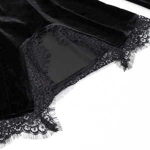 Detailed view of premium black velvet fabric with delicate eyelash lace trim at the hem