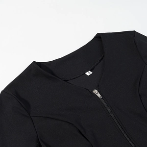Close-up of black top with silver metal zipper neckline and size S woven label detail