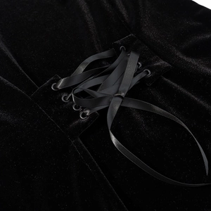 Close-up of black velvet top featuring lace-up corset detail and satin ribbons