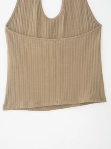 Detail of khaki brown halter top showing ribbed knit fabric texture and seam quality