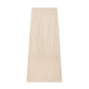 Detailed view of beige knit maxi skirt featuring delicate chevron pointelle hollow patterns