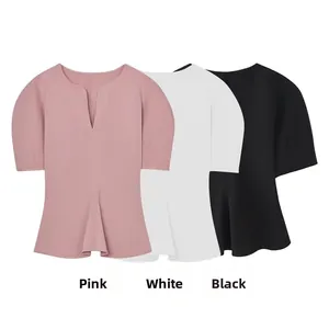 Detailed flat lay of V-neck peplum tops in pink, white, and black colors