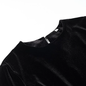 Women's black velvet long-sleeve top with elegant crew neck and rear teardrop cutout