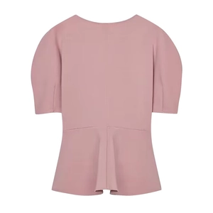 Front view of mauve short-sleeve top featuring puff sleeves and ruffled peplum hemline