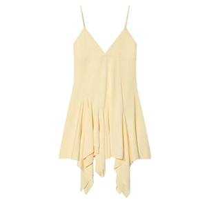 Flat lay of pale yellow dress with deep V-neck and asymmetrical ruffled hem details