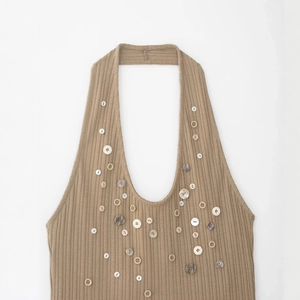 Brown ribbed knit halter top with decorative mixed buttons in a vintage style
