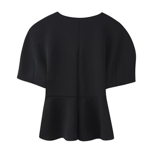 Detail of a black short sleeve peplum top featuring a tailored waist and flared hemline