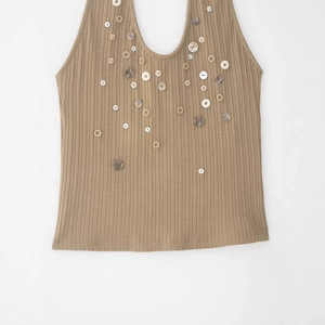 Women's ribbed knit halter top in khaki featuring decorative multi-color buttons