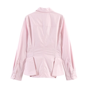 Detailed back view of a pink long-sleeved shirt with structural seams and a flared hemline