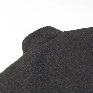 Macro view of charcoal grey high-quality fabric texture and collar seam detail