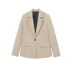 Detail of a beige slim fit blazer with single button closure and symmetrical flap pockets