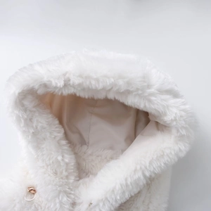 Detail of soft white faux fur hood with smooth satin lining and metal zipper puller