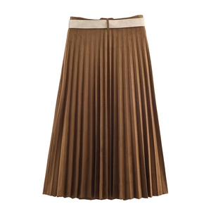 Close-up of brown pleated midi skirt with suede effect fabric and beige waist belt