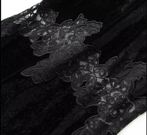 Close-up of premium black velvet dress with delicate lace floral embroidery details