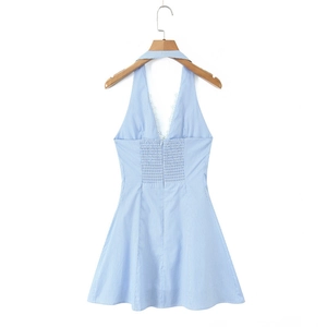 Close-up of light blue striped dress with deep V-neck and white lace trim detail