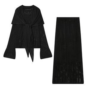 Three-piece black knit set with hollow wave pattern top and matching long skirt