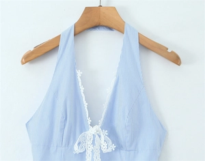 Detail of V-neck striped halter top with white lace flower trim and bow decoration