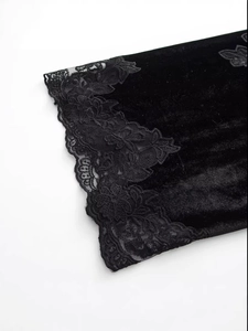 Elegant black velvet dress with vintage lace trim details and floral pattern sleeves