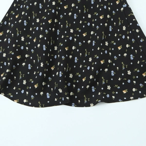 Robe moulante à fleurs pour femmes avec motifs blancs et jaunes sur tissu noir