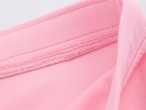 Close-up of pink pilot jacket neckline with neat stitching and premium cotton texture
