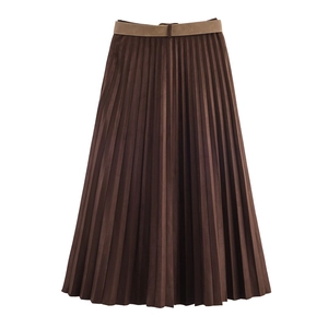 Close-up of brown pleated midi skirt featuring a faux leather belt and suede texture
