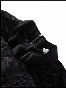 Elegant black velvet dress featuring lace patchwork and high stand collar detail
