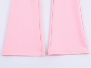 Detail of pink flare trousers showing double-needle hem and premium elastic knit fabric