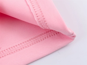 Detail shot of the fine double-needle stitching on the pink knit bomber jacket sleeve