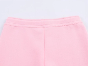 Detail of the high-quality elastic waistband and pink knit fabric on these sporty pants