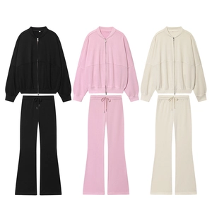 Women's lounge tracksuit set with zip-up jacket and flared pants in three neutral colors