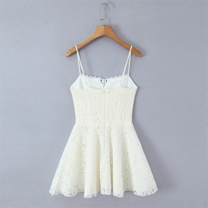 Elegant white lace slip dress with floral embroidery and a flared mini skirt