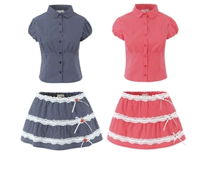 Detailed view of polka dot shirt and layered lace skirt sets with bow accents