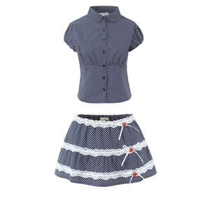 Detail view of navy blue polka dot short-sleeve shirt and layered lace skirt set for girls