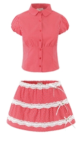 Detail of red polka dot shirt and tiered lace skirt set with small bow accents